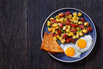 Corned Beef Hash Browns with fried eggs, top view