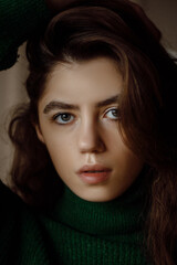 Fototapeta premium Young female portrait, attractive and sexy portrait of caucasian girl, hairstyle and makeup on a dark background