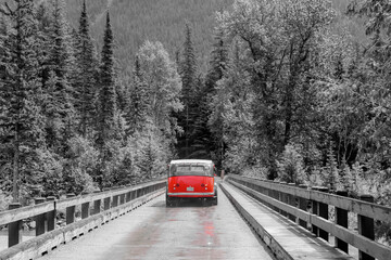 Red tour bus in Glacier national park, Montana.