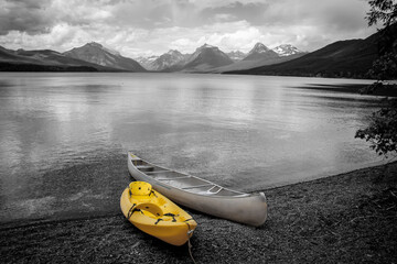 Canoe and Kayak at lake McDonald shore line in glacier national park, Montana.