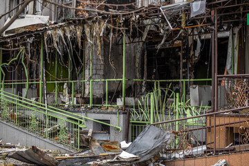 Irpin, Kyev region Ukraine - 09.04.2022: Cities of Ukraine after the Russian occupation. Destroyed buildings on the streets of Irpen. Broken, shelled windows. Buildings after being hit by missiles.