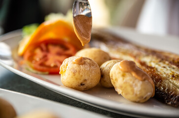 Tasty fried fish and sea fruits with potato traditional Canarias dish.