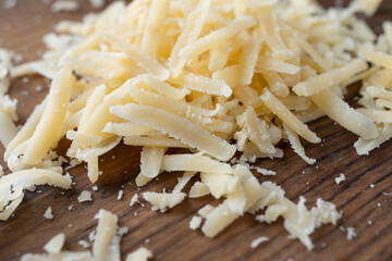 Heap of grated parmesan, healthy food, dairy product