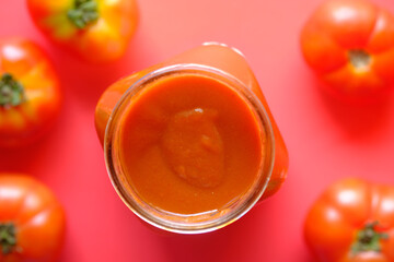  tomato sauce in a jar with fresh tomato on table 