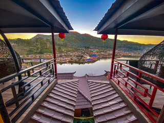 Sunrise with fog over Ban Rak thai, chinese village near a lake in Mae Hong Son, Thailand