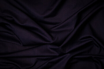 Sport clothing fabric texture background. Navy blue fabric sport clothing football jersey with air...