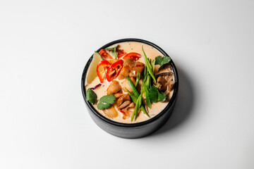 Ramen, noodle and egg soup, Asian food, Ramen in a black round plate, Ramen with chicken and mussels