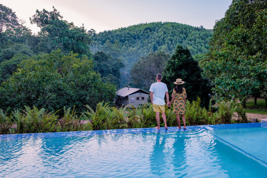 couple man and woman at a swimming pool during a vacation in South Africa. at a safari camping