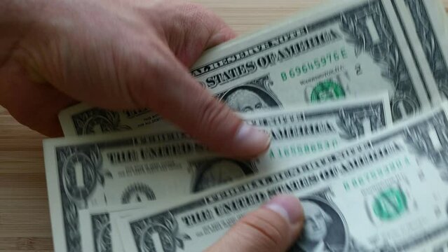 American dollars, Transferring paper dollar bills in the hands