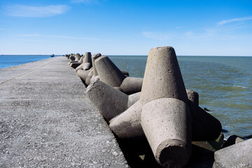 The Northern Breakwater in Liepaja, a close-up of tetrapods and splashing, splattering waves....