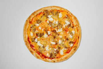 delicious hot pizza with chicken, mozzarella and tomatoes on a white background top view