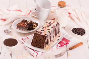 Sponge cake with white frosting and sugars.