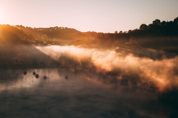 Sunrise with fog over Ban Rak thai, chinese village near a lake in Mae Hong Son, Thailand