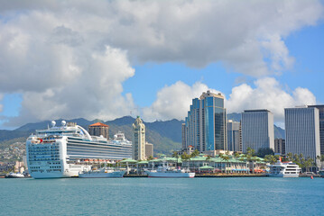 View across Honolulu harbor of downtown Honolulu condos and cruise ship at Aloha Tower Marketplace...