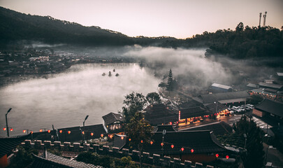 Sunrise with fog over Ban Rak thai, chinese village near a lake in Mae Hong Son, Thailand