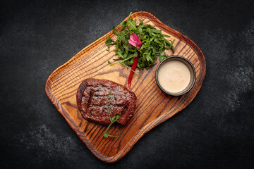Meat steak on the wooden board