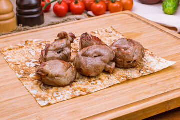 skewers of mutton flesh on the board macro close up