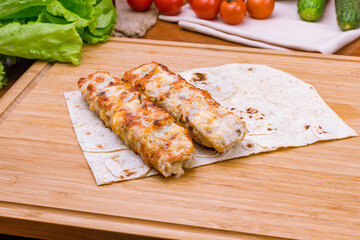 Lula kebab chicken on the board macro close up