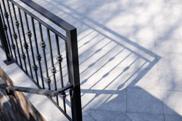 Modern metal railings and handrails in the loft style. The metal is treated with a primer and anti-corrosion paint. Interior design in industrial style.