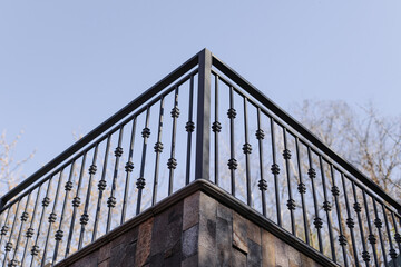 Modern metal railings and handrails in the loft style. The metal is treated with a primer and...