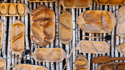 National cuisine background with wooden spoons. plates, trays
