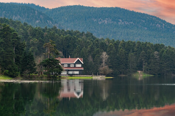 Obraz premium Bolu Golcuk Tabiat Parki. Bolu National Park. Landmarks or touristic places of Turkey. Wooden green house by the lake. 