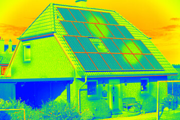 Thermographic inspection of photovoltaic systems by house.Thermovision image of solar panels....