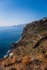 Fototapeta na wymiar View of a road with many curves in Canico, Madeira on the coastline. October 2021
