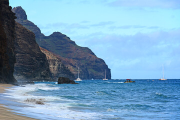 Tour boats along the Na Pali Coast on the northshore of Kauai in Hawaii