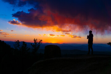 Obraz na płótnie Canvas Colorful Sunrise Person At Sunset beautiful view