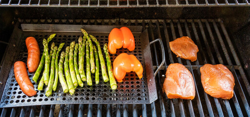 grilled chicken and sausage with vegetables