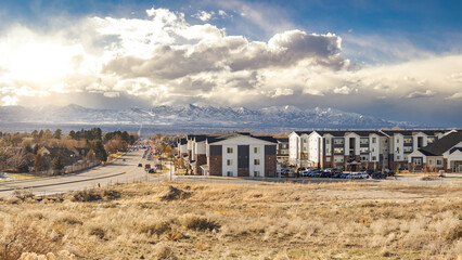 Salt Lake City, Utah Suburb Housing Development, Mountain Background with Overcast Sky next to a...