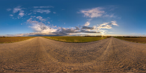 full seamless spherical hdri 360 panorama view on no traffic gravel road among fields in summer...