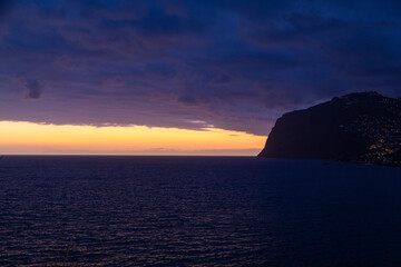 Naklejka na ściany i meble Sunset over the ocean, Funchal, Madeira, Portugal