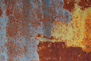 rusty metal background with blue and yellow paint