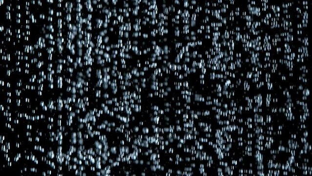 Super Slow Motion Shot of Many Water Drops Falling Down on Black Background at 1000fps.
