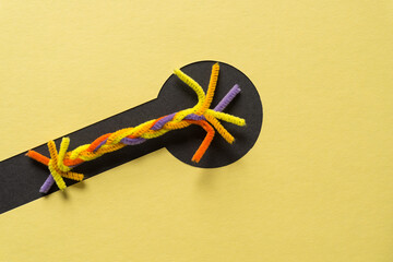 abstract pipe cleaner shape on paper with circular design