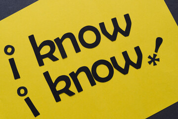 letters on paper - "i know, i know" with asterisk/exclamation mark