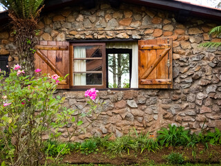 Fototapeta na wymiar Monte Verde, Minas Gerais, Brasil - April 22 2022: traditional stone housing with wooden window 