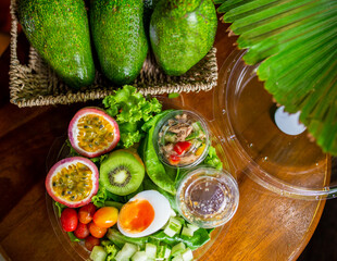 Salad Box on wood table, Salad with tuna and vegetable