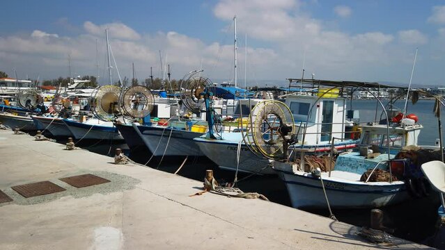Colourful fishing boats moored in the port of Paphos, Cyprus. Wide