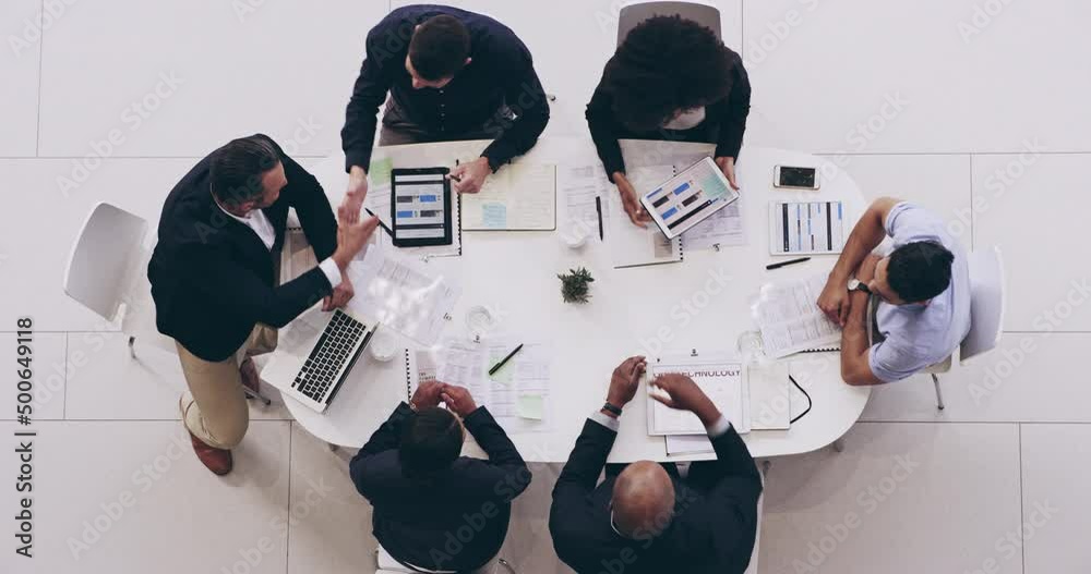 Poster what are our next steps. high angle 4k video footage of a group of businesspeople having a meeting t