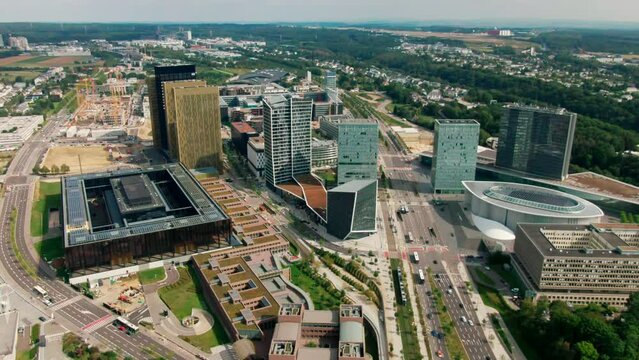 Aerial view of Court of Justice and Administrative Offices of European Union in Kirchberg quarter of Luxembourg City. Urban Cityscape of Downtown. 4K drone panoramic establishing shot