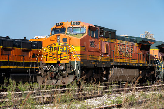 
Galveston,  Texas, USA - March 12, 2022: Many locomotives stored at a railyard in Galveston, Texas, USA on March 12, 2022. The locomotives being put out to pasture are being replaced by newer engines