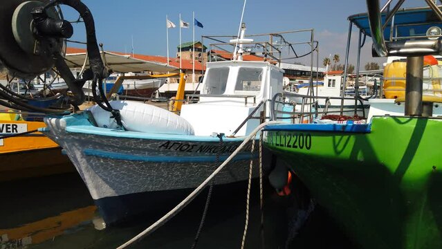 Colourful fishing boats moored in the port of Paphos, Cyprus