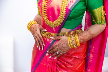 South Indian Tamil bride's wearing her wedding outfit and jewellery close up