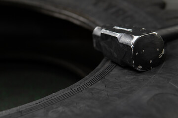 Sledgehammer crossfit wheel black tire workout athlete bodybuilding equipment, from effort cross...