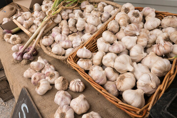 baskets of garlic at a farmers market