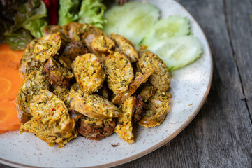 Close up of Northern Thai Sausage (or Sai Oua) served with vegatables. Sai Oua is popular in Northern Thailand you can easily find this dish in most market streets in the city.