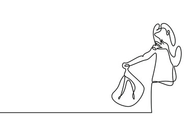 a woman holds a smelly garbage bag and covers her nose with her other hand